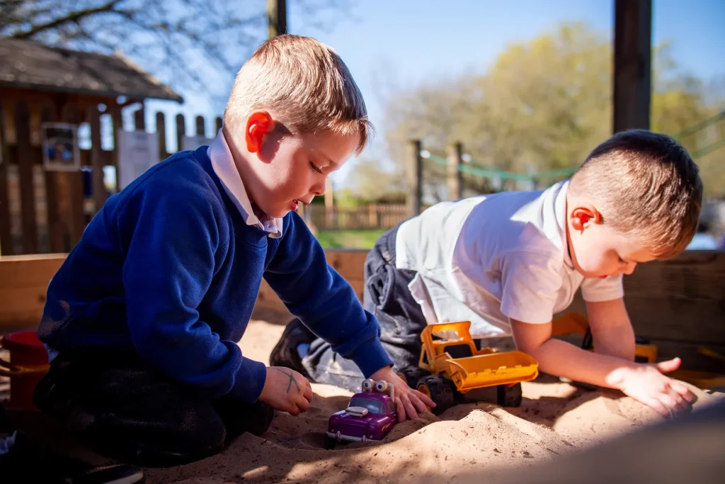Children playing in the early years sandpit 2